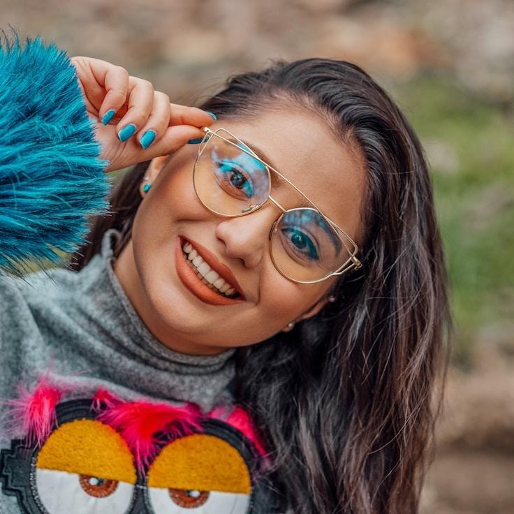 Asha Rao, Lead Design Curator at Global Meadow Center, reviewing corporate floral arrangements